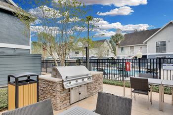 Patio with grill and chairs